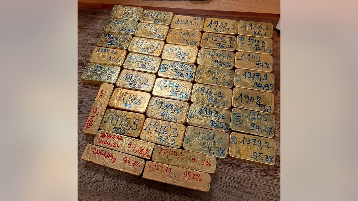 Police are investigating a possible international gold smuggling syndicate after three suspects were arrested with the gold bars in their carry-on luggage. (South African Police Services via AP)