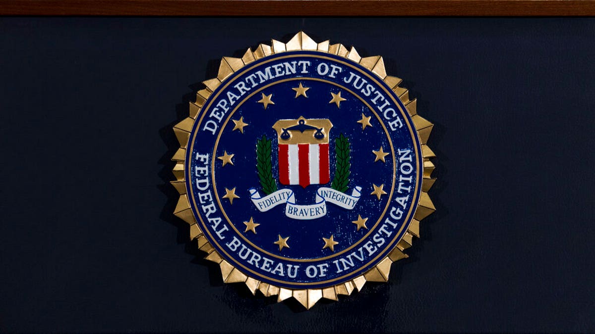 The FBI seal is seen before a news conference at FBI headquarters in Washington. 