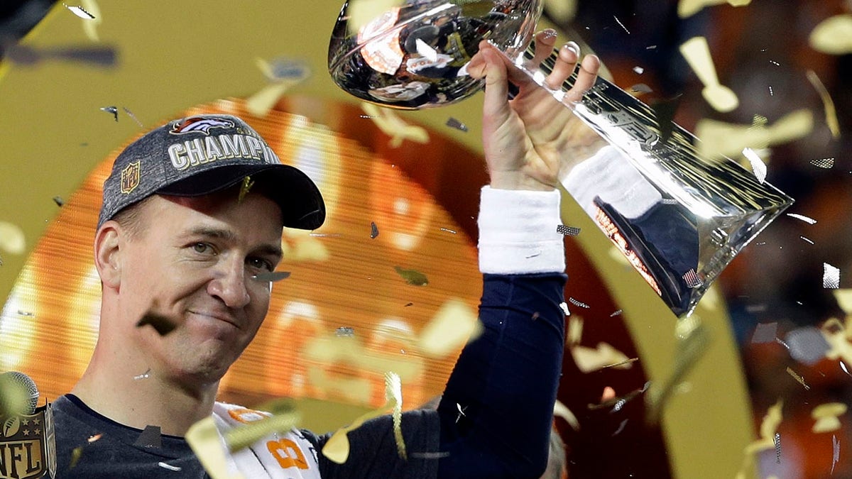 In this Feb. 7, 2016, file photo, Denver Broncos quarterback Peyton Manning holds up the Vince Lombardi Trophy after the Broncos defeated the Carolina Panthers 24-10 in NFL football's Super Bowl 50 in Santa Clara, Calif. (AP Photo/Julie Jacobson, File)