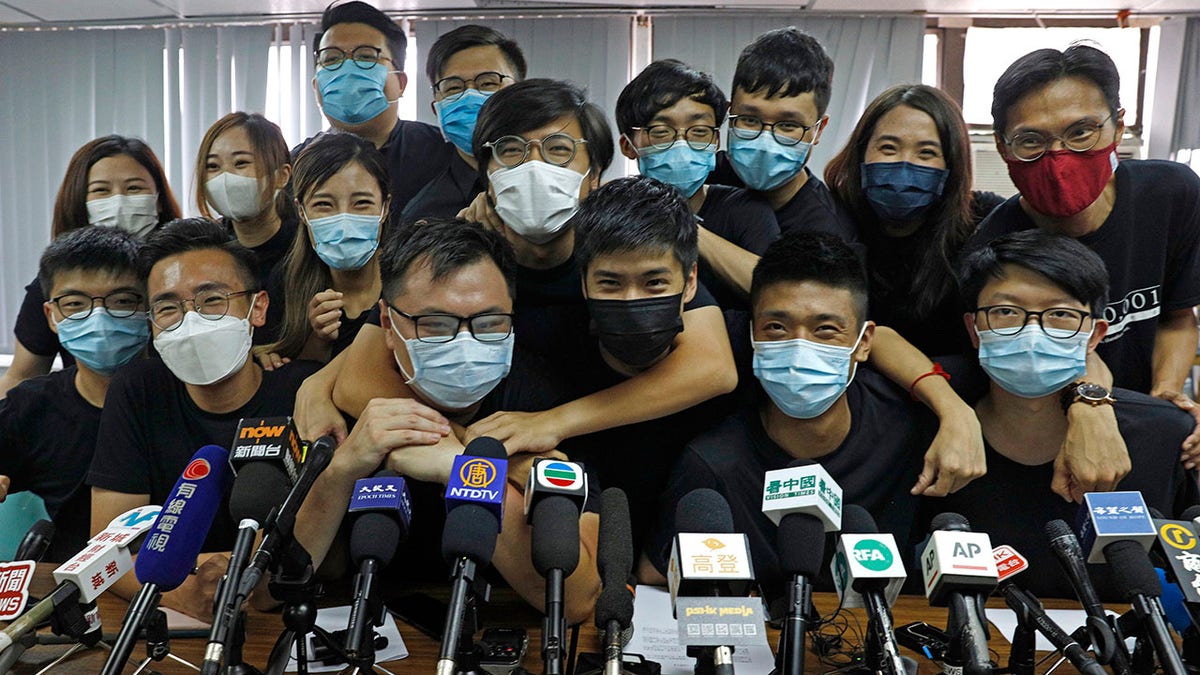 FILE - In this July 15, 2020, file photo, pro-democracy activists who were elected from unofficial pro-democracy primaries, including Joshua Wong, left, attend a press conference in Hong Kong. About 50 Hong Kong pro-democracy figures were arrested by police on Wednesday, Jan. 6, 2021 under a national security law, following their involvement in an unofficial primary election last year held to increase their chances of controlling the legislature, according to local media reports. (AP Photo/Kin Cheung, File)