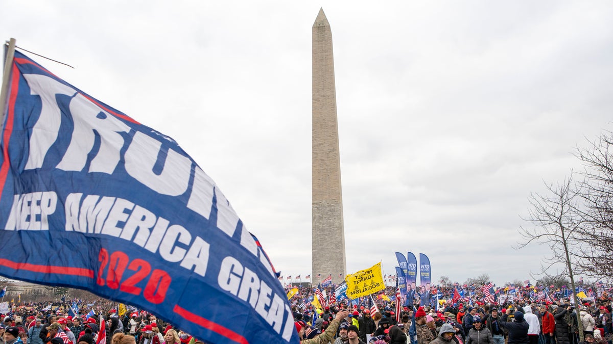 With the Washington Monument in the background, people attend a rally in support of President Donald Trump on Wednesday, Jan. 6, 2021, in Washington. (AP Photo/Jose Luis Magana)