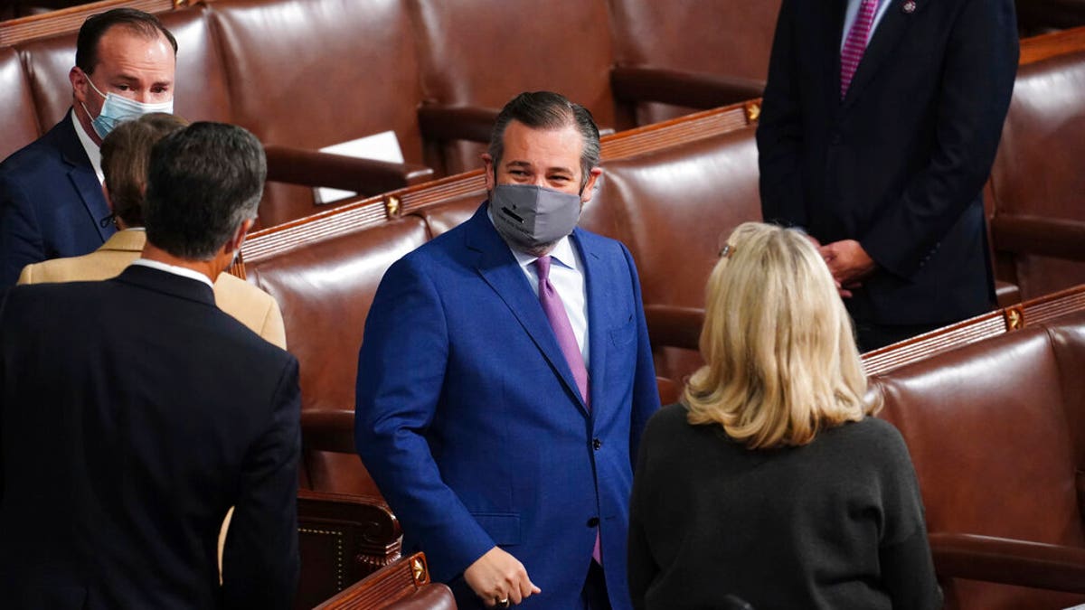 Sen. Ted Cruz, R-Texas, arrives as a joint session of the House and Senate convenes to confirm the Electoral College votes cast in November's election, at the Capitol in Washington, Jan. 6. (Kevin Dietsch/Pool via AP)