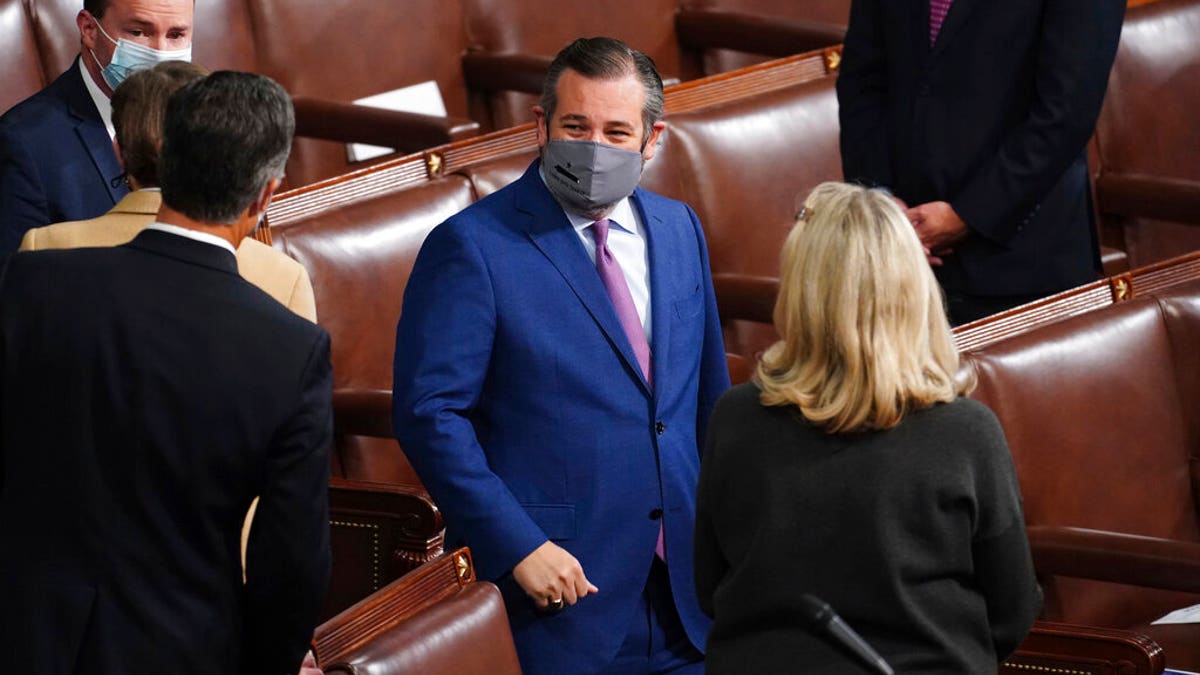 Sen. Ted Cruz, R-Texas, arrives as a joint session of the House and Senate convenes to confirm the Electoral College votes cast in November's election, at the Capitol in Washington, Jan. 6. (Kevin Dietsch/Pool via AP)