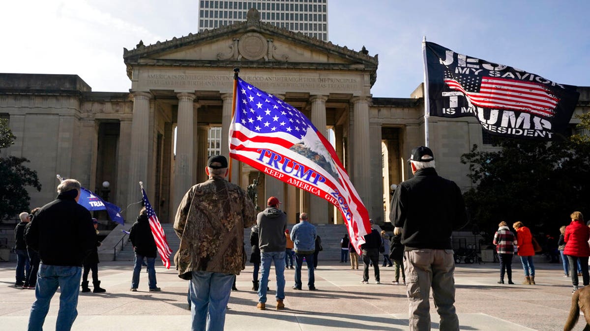People take part in a rally at the Legislative Plaza, Jan. 6, in Nashville, Tenn. 