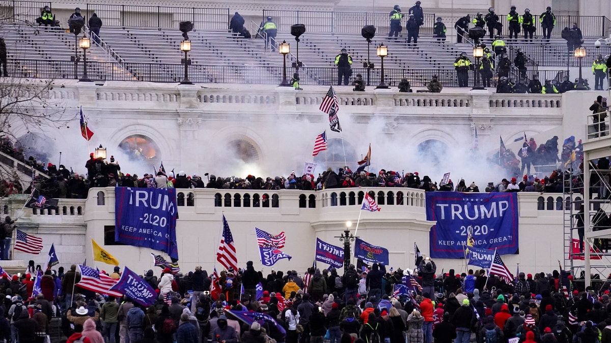 Violent protesters, loyal to President Trump, storm the Capitol, Jan. 6,, in Washington.  (AP Photo/John Minchillo)