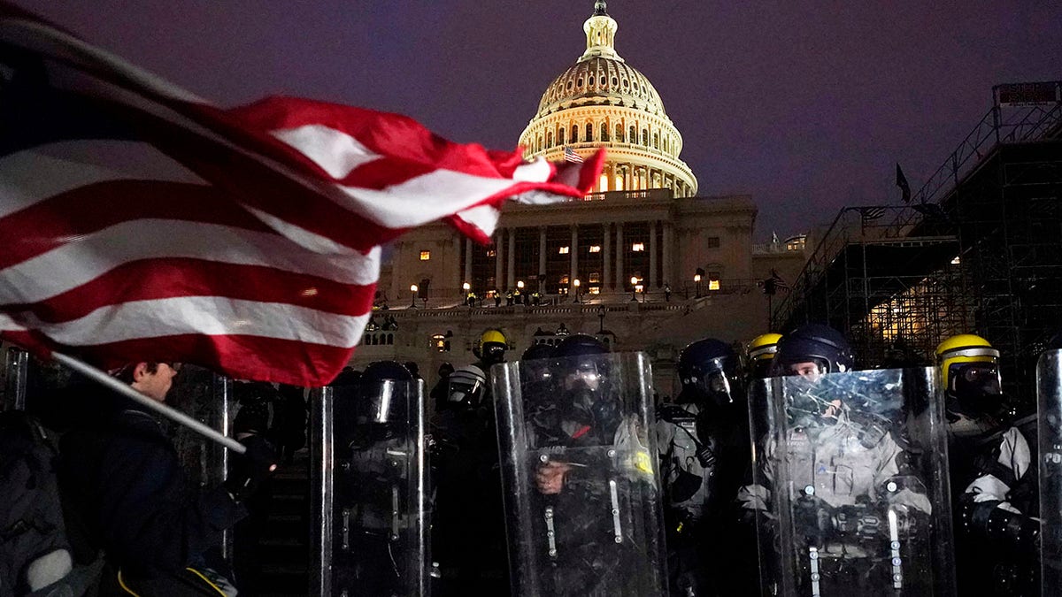 Police stand guard after a day of riots at the U.S. Capitol in Washington on Wednesday, Jan. 6, 2021. (Associated Press)
