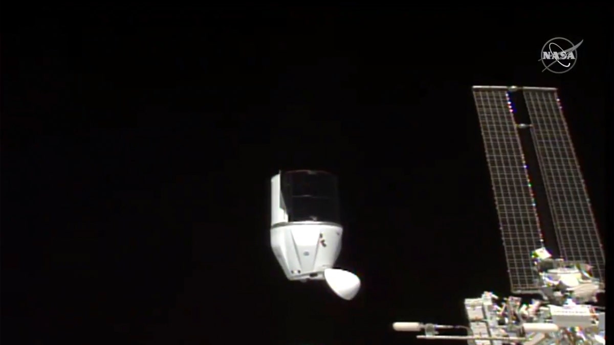 This photo provided by NASA shows SpaceX's Dragon undocking from International Space Station on Tuesday, Jan. 12, 2021. (NASA via AP)