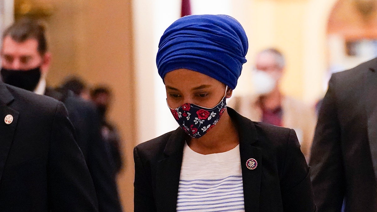Rep. Ilhan Omar, D-Minn., walks to the House chamber on Capitol Hill in Washington