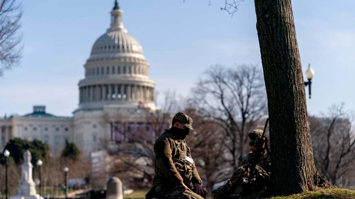 Members of the National Guard work outside the U.S Capitol building on Capitol Hill in Washington, Thursday, Jan. 14, 2021. (AP Photo/Andrew Harnik)