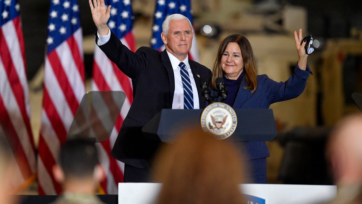 Vice President Mike Pence and second lady Karen Pence wave following remarks to Army 10th Mountain Division soldiers