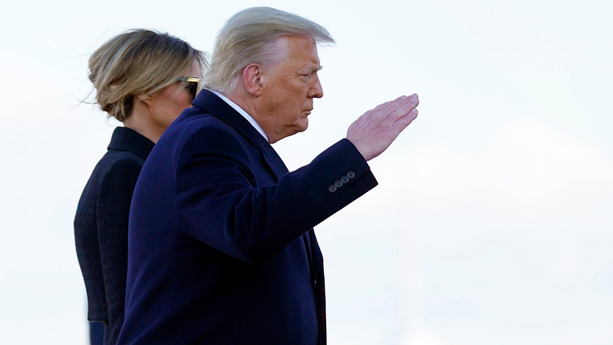 President Donald Trump and first lady Melania Trump board Air Force One at Andrews Air Force Base, Md., Wednesday, Jan. 20, 2021.(AP Photo/Manuel Balce Ceneta)