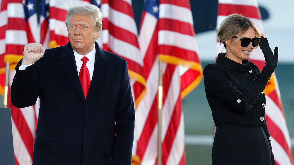 President Donald Trump and first lady Melania Trump wave to supporters after giving a speech at Andrews Air Force Base, Md., Wednesday, Jan. 20, 2021. (AP Photo/Luis M. Alvarez)