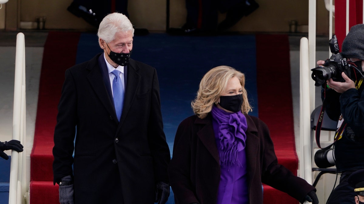 Former President Bill Clinton and his wife former Secretary of State Hillary Clinton arrive for the 59th Presidential Inauguration at the U.S. Capitol. (AP Photo/Patrick Semansky, Pool)