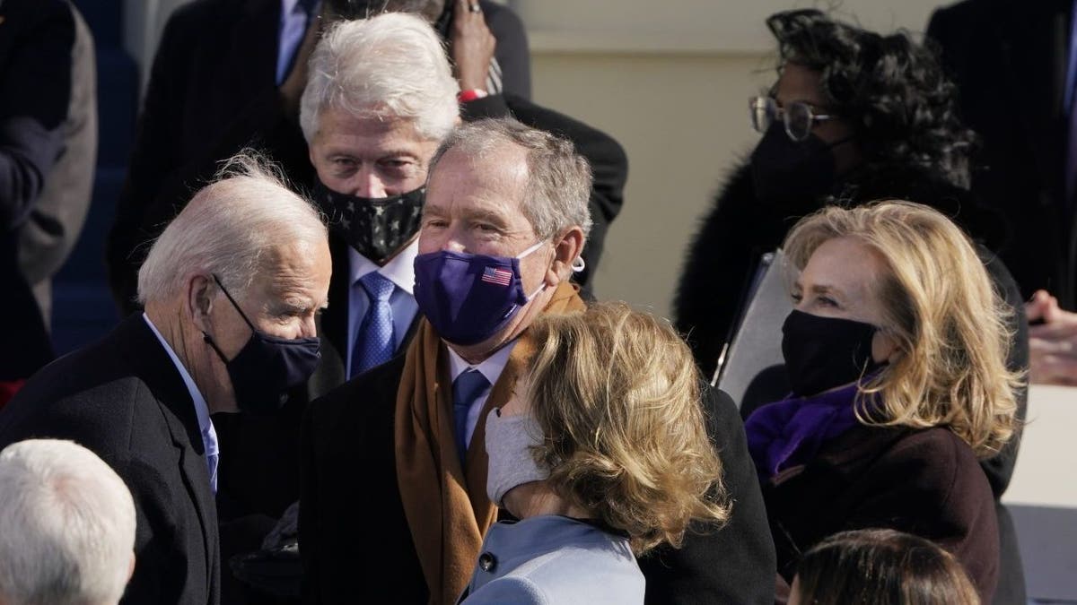 President Joe Biden talks with former President George Bush and former first lady Laura Bush and former President Bill Clinton and former Sec. of State Hillary Clinton, after the 59th Presidential Inauguration at the U.S. Capitol in Washington, Wednesday, Jan. 20, 2021. (AP Photo/Patrick Semansky, Po