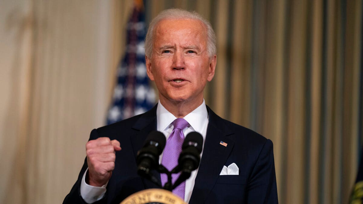 President Joe Biden delivers remarks on racial equity, in the State Dining Room of the White House, Tuesday, Jan. 26, 2021, in Washington. (AP Photo/Evan Vucci)