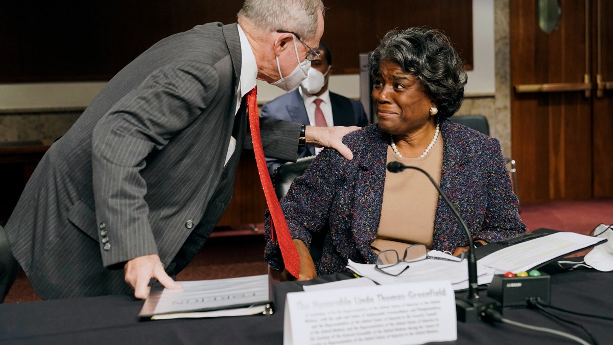 Sen. James Risch, R-Idaho, left, greets United States Ambassador to the United Nations nominee Linda Thomas-Greenfield before her confirmation hearing before the Senate Foreign Relations Committee on Capitol Hill, Wednesday, Jan. 27, 2021, in Washington. (Greg Nash/Pool via AP)