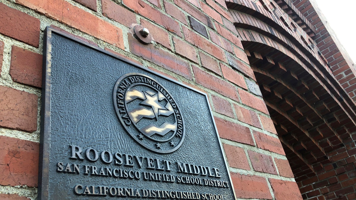 A plaque for Roosevelt Middle School is seen outside the school in San Francisco, on Wednesday, Jan. 27, 2021. (AP Photo/Haven Daley)