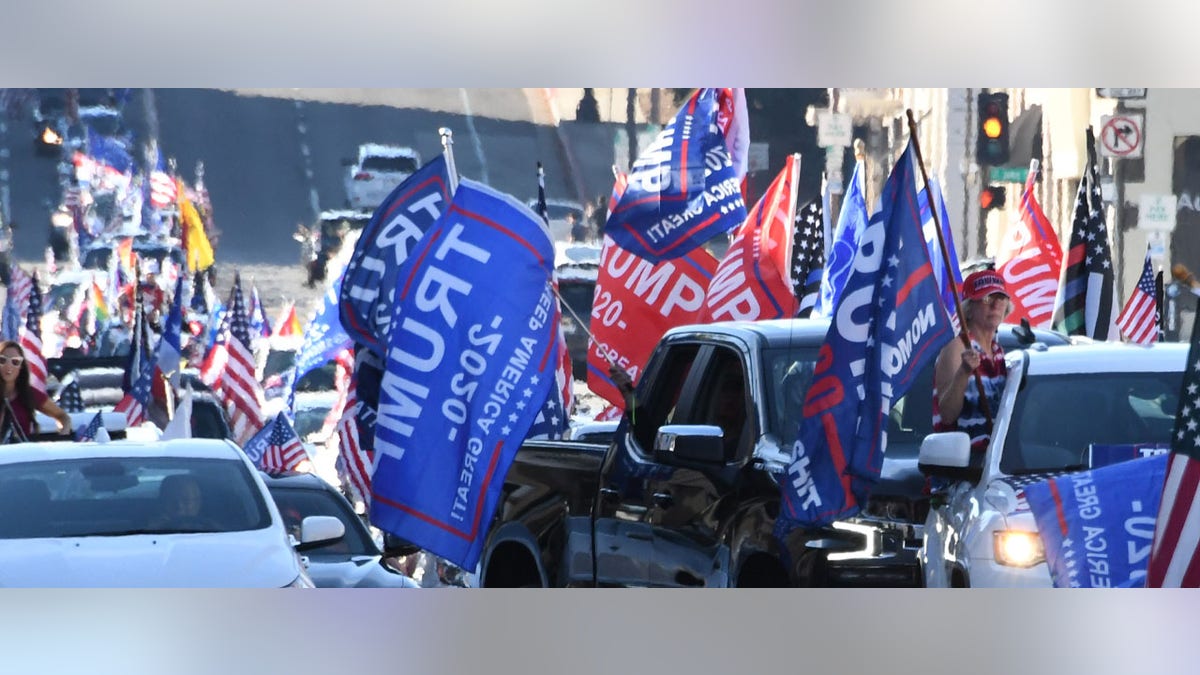 Trump supporters caravan along the Rose Parade route on Colorado Blvd in Pasadena on January 1, 2021. Pasadena, CA - January 01: Trump supporters parade along the Rose Parade route on Colorado Blvd in Pasadena on Friday, January 1, 2021. (Photo by Keith Birmingham/MediaNews Group/Pasadena Star-News via Getty Images)