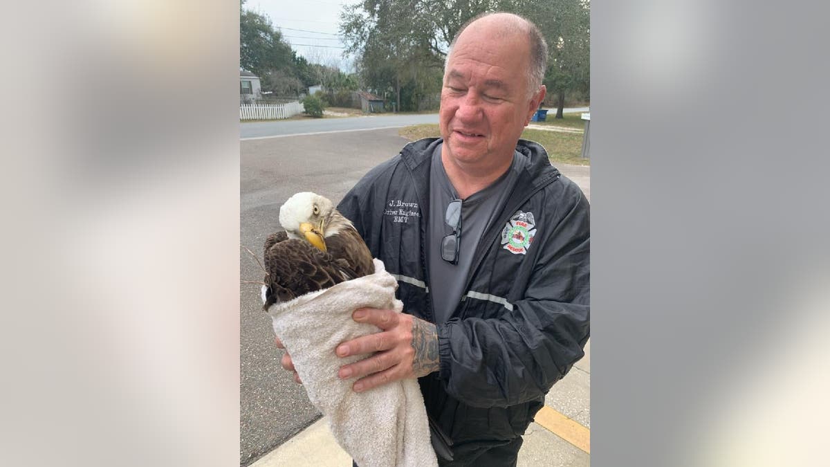 Driver Engineer Jerry Brown of Pasco County Fire Rescue assisted the two children who found the injured bald eagle.