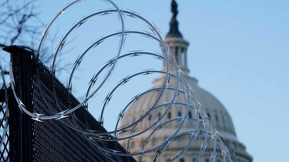 Razor wire is on top of security fencing that surrounds the U.S. Capitol in Washington, Monday, Jan. 18, 2021, ahead of the 59th Presidential Inauguration. (AP Photo/Susan Walsh)