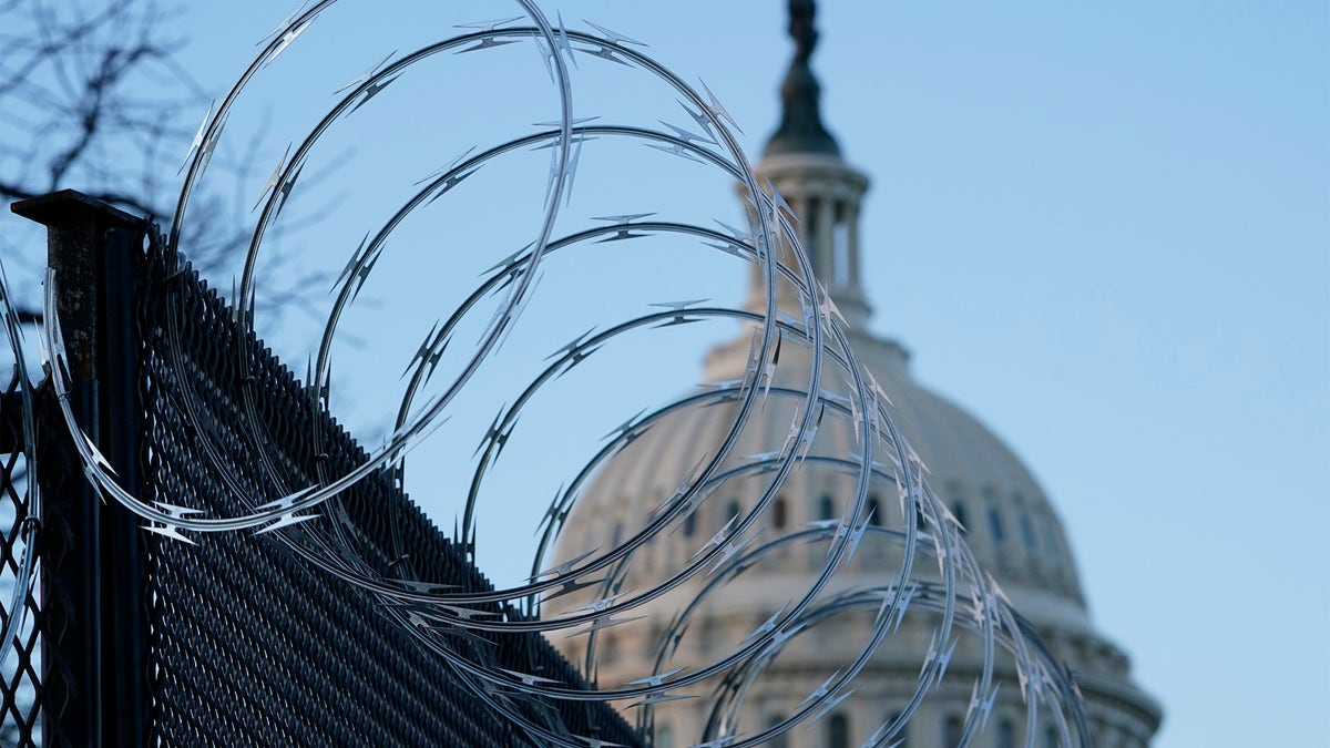 Razor wire is on top of security fencing that surrounds the U.S. Capitol in Washington, Monday, Jan. 18, 2021, ahead of the 59th Presidential Inauguration. (AP Photo/Susan Walsh)