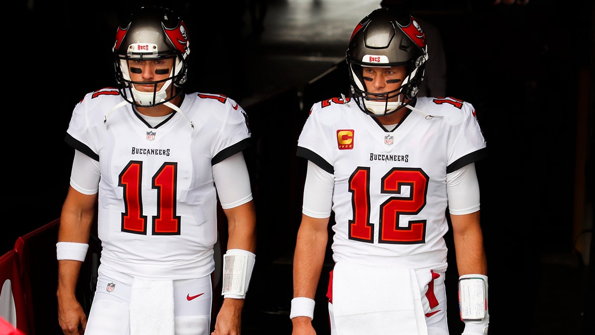 Tom Brady #12 of the Tampa Bay Buccaneers and Blaine Gabbert #11 of the Tampa Bay Buccaneers enter the field before the start of a game against the Los Angeles Chargers at Raymond James Stadium on Oct. 4, 2020 in Tampa, Florida.