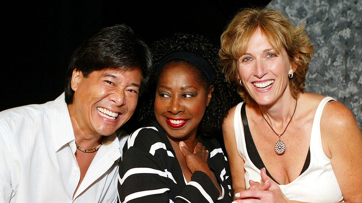 Marion Ramsey (center) with fellow 'Police Academy' franchise alums Brian Tochi (left) and Kathryn Graf (right). (Photo by Kevin Winter/Getty Images)