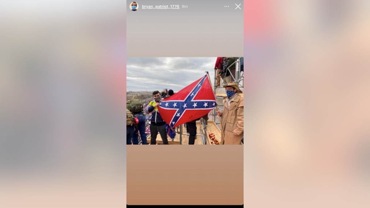Bryan Betancur, left, posing with Confederate flag on Jan. 6 at the Capitol riot. 