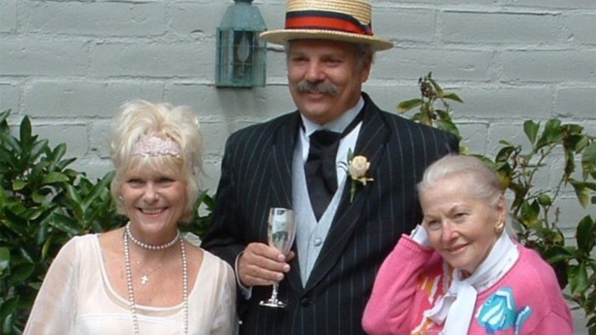 Bill Cassara (center) with his wife Michelle Benton (left) and Joan Fontaine (right).