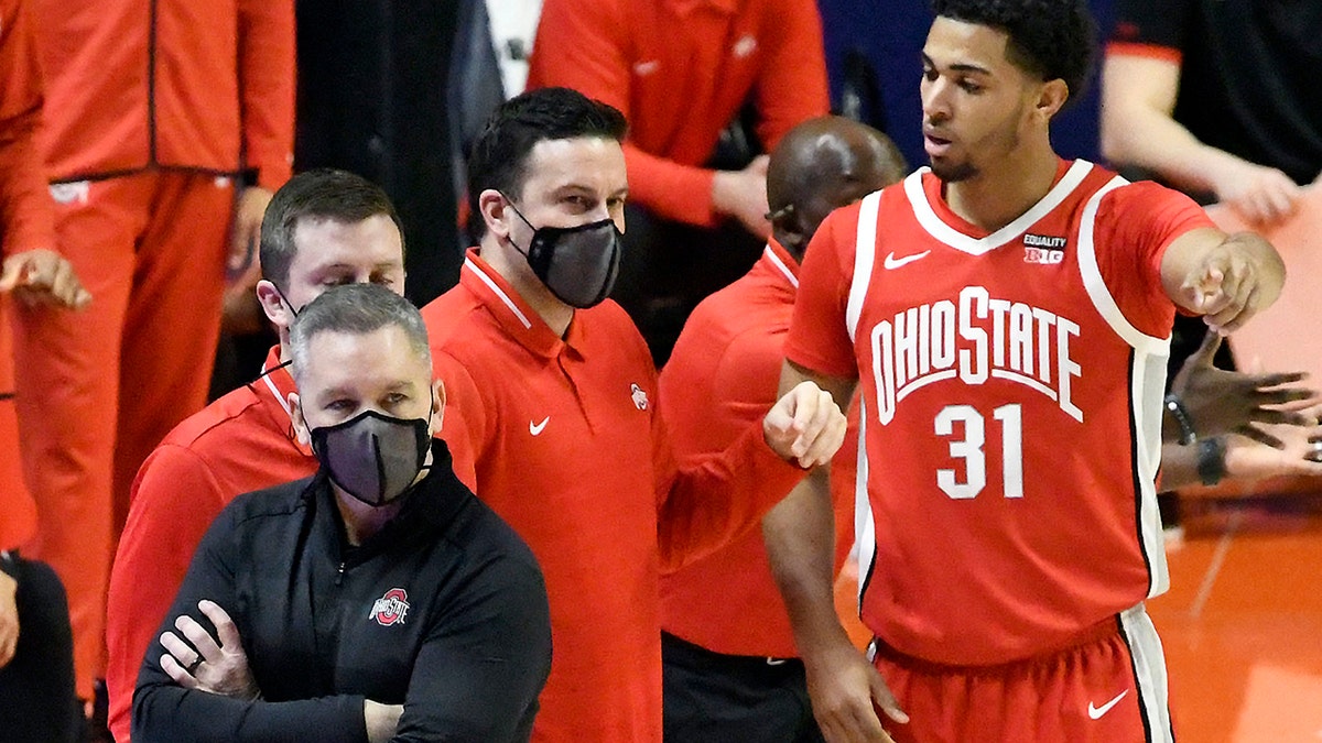 Ohio State Head Coach Chris Holtmann looks on from the sideline in the first half of an NCAA college basketball game against Illinois, Saturday, Jan. 16, 2021, in Champaign, Ill. (AP Photo/Holly Hart)