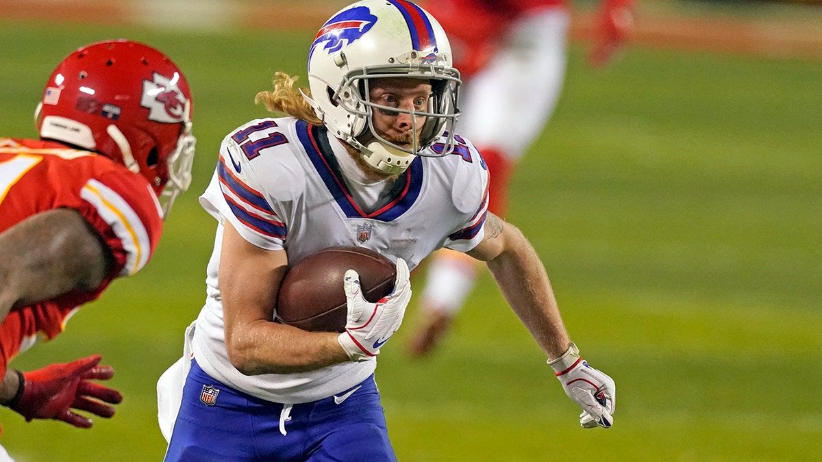 Buffalo Bills wide receiver Cole Beasley (11) runs from Kansas City Chiefs cornerback Bashaud Breeland (21) after catching a pass during the second half of the AFC championship NFL football game, Sunday, Jan. 24, 2021, in Kansas City, Mo. (AP Photo/Charlie Riedel)