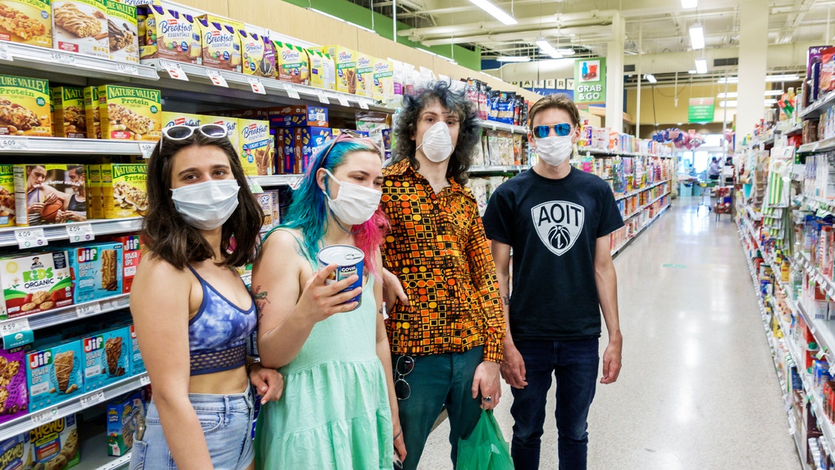 Miami Beach teens in face masks shopping at a Publix grocery store. 