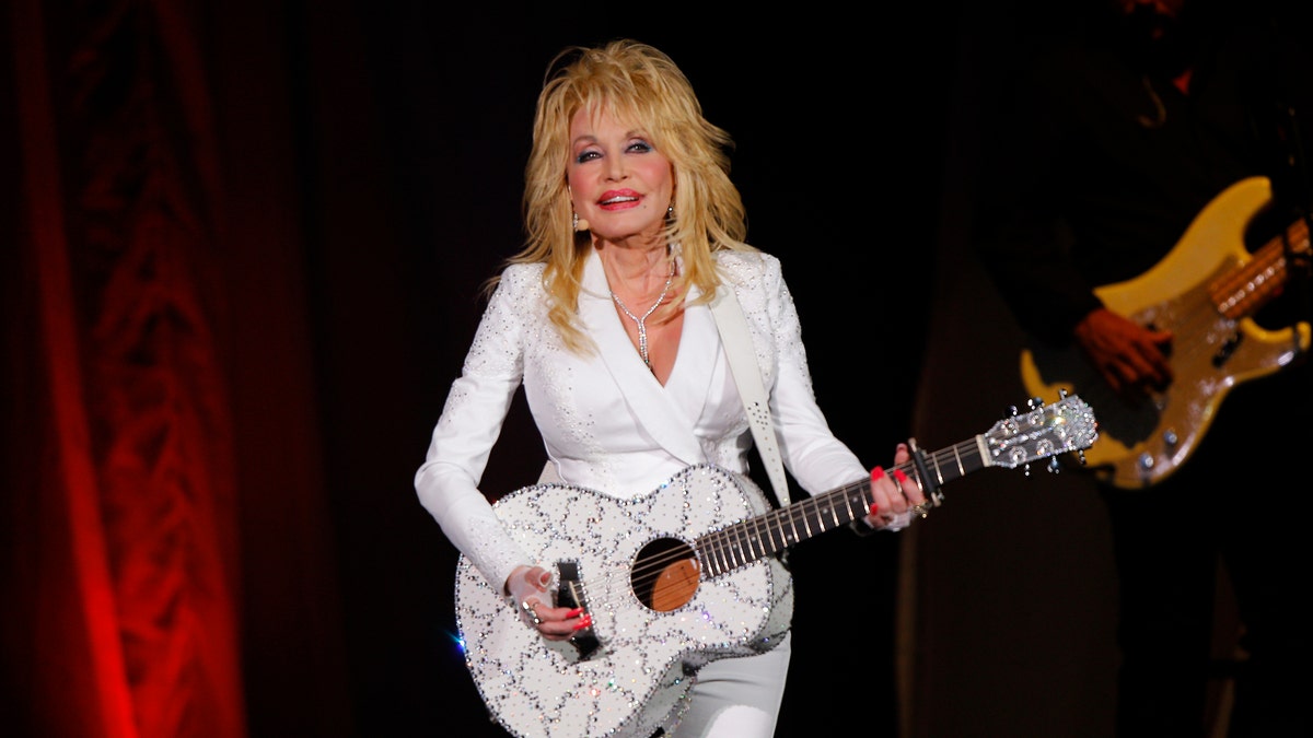 Dolly Parton is widely recognized for her music and acting, but also for her philanthropy, including a large donation to coronavirus research. (Photo by Wade Payne/Invision/AP, File)