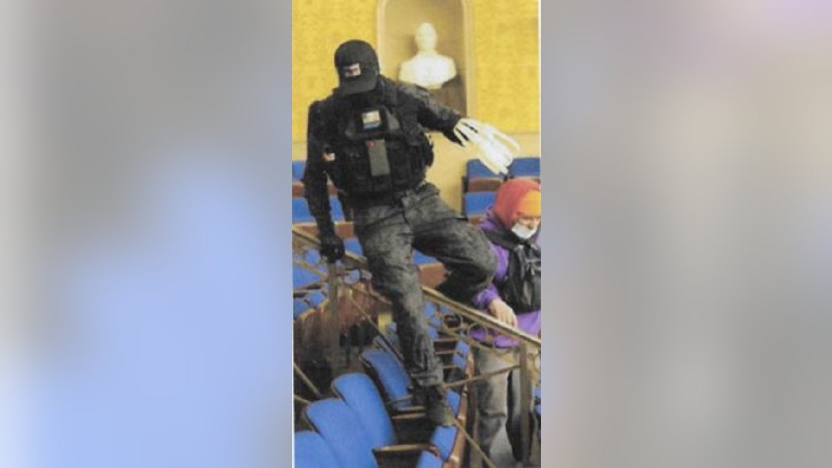 Eric Munchel, 30, is believed to be a man photographed carrying zip ties into the Senate Chamber during last week's riot at the Capitol building, the FBI said. 