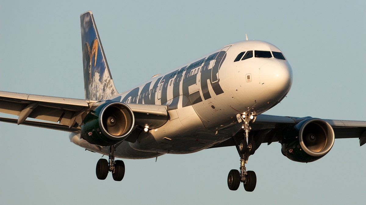 A Frontier Airlines plane landing