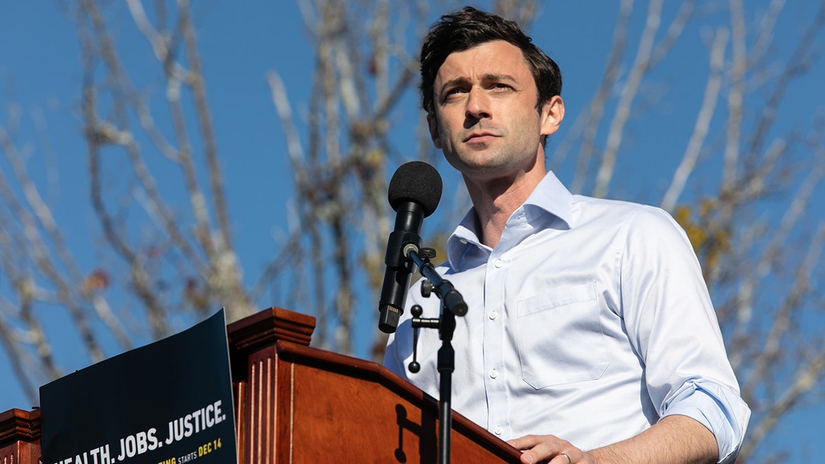 Democratic U.S. Senate candidate Jon Ossoff speaks to the crowd during an outdoor drive-in rally on December 5, 2020 in Conyers, Georgia. (Photo by Jessica McGowan/Getty Images)