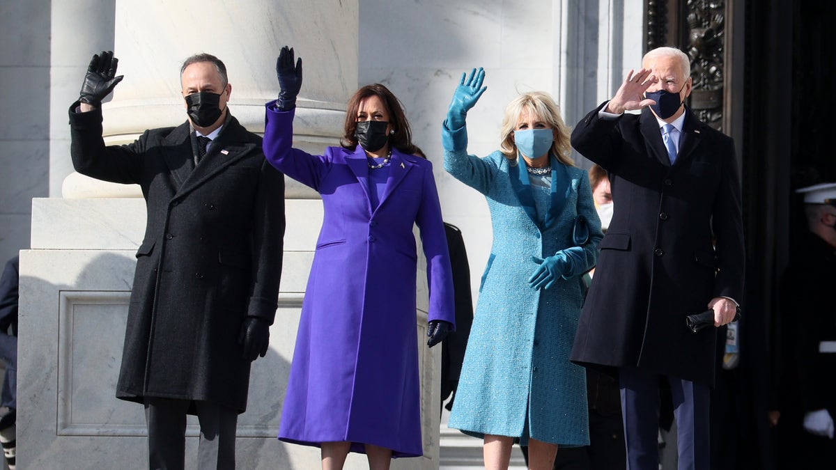 Vice President Kamala Harris and President Joe Biden, seen here with Harris' husband Doug Emhoff and first lady Jill Biden, wave as they arrive on the East Front of the U.S. Capitol for the inauguration on January 20, 2021. (Photo by Joe Raedle/Getty Images)