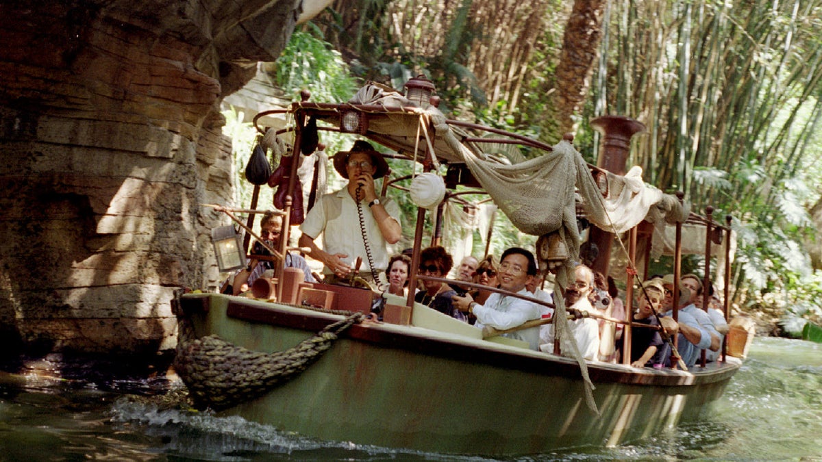 A photo of a tour group on the Jungle Cruise in Disneyland.