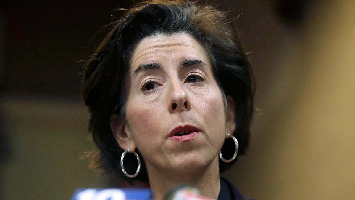Commerce Sec. Gina Raimondo, then-Governor of Rhode Island, faces reporters during a news conference, in Providence.