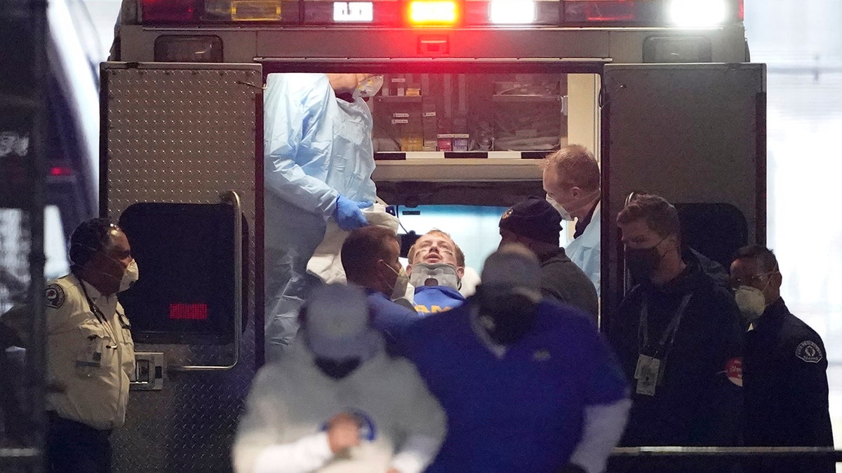 Los Angeles Rams quarterback John Wolford leans back after walking into an ambulance parked in a tunnel just off the field during the first half of an NFL wild-card playoff football game against the Seattle Seahawks, Saturday, Jan. 9, 2021, in Seattle. (AP Photo/Ted S. Warren)