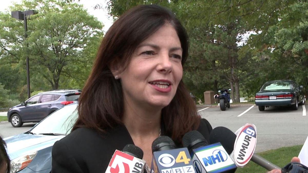 Then-Sen. Kelly Ayotte of New Hampshire speaks to reporters during her 2016 re-election campaign.