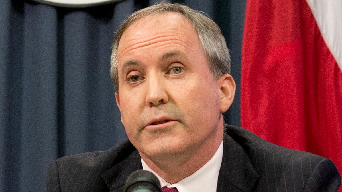 Texas Gov. Greg Abbott, l, and Attorney General Ken Paxton hold a press conference to address a Texas federal court's decision on the immigration lawsuit filed by 26 states challenging President Obama. Paxton was indicted Monday on three counts of securities fraud unrelated to his official duties. (Photo by Robert Daemmrich Photography Inc/Corbis via Getty Images)