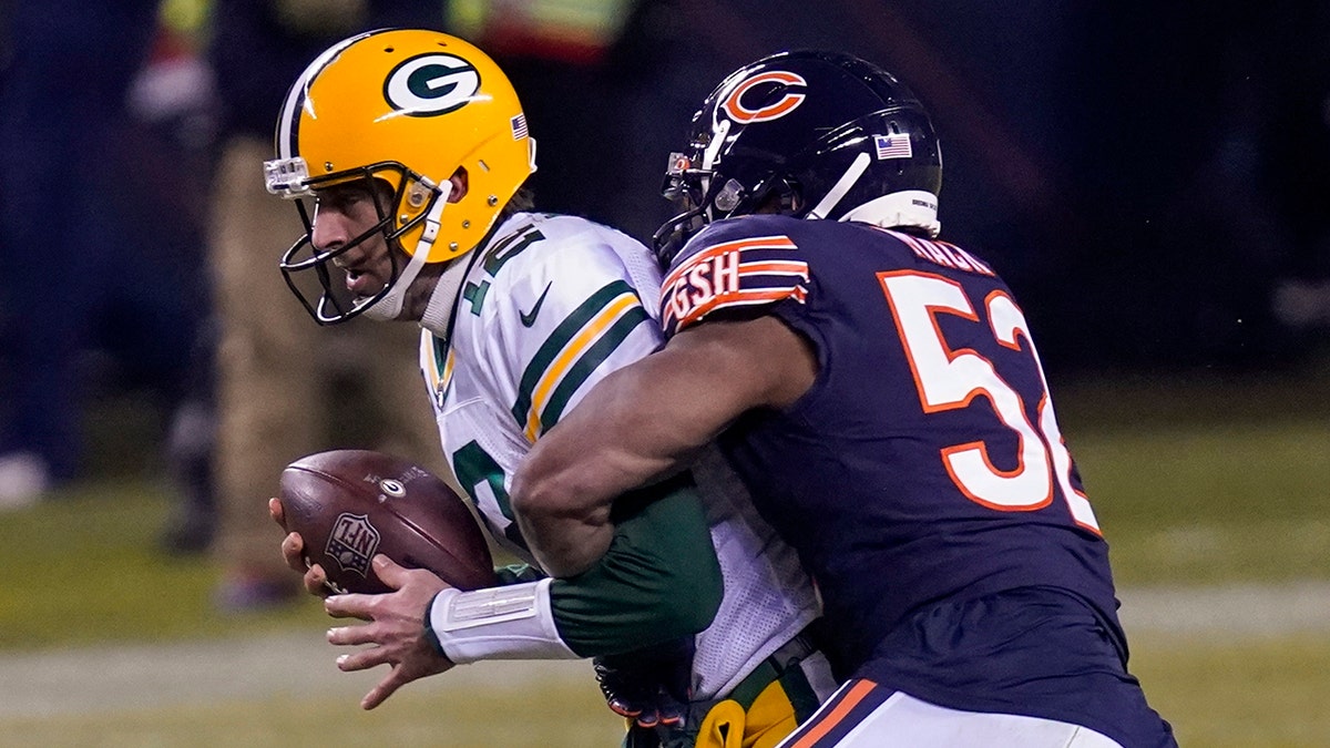 Green Bay Packers' Aaron Rodgers is sackec by Chicago Bears' Khalil Mack during the second half of an NFL football game Sunday, Jan. 3, 2021, in Chicago. (AP Photo/Charles Rex Arbogast)