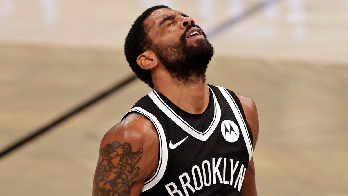 Brooklyn Nets guard Kyrie Irving reacts to missing a shot during the second half of the team's NBA basketball game against the Atlanta Hawks, Friday, Jan. 1, 2021, in New York. (AP Photo/Adam Hunger)