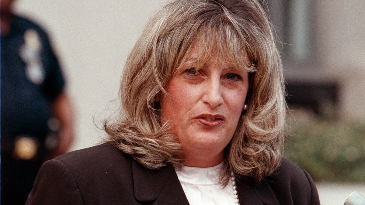 Linda Tripp talks to the press outside the Federal Courthouse July 29, 1998 in Washington, DC.