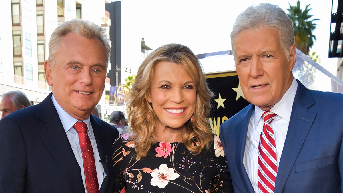 'Wheel of Fortune' hosts Pat Sajak (left) and Vanna White (center) opened up about their 'admiration' for 'Jeopardy!' host Alex Trebek (right) after his death. (Photo by Rodin Eckenroth/WireImage)