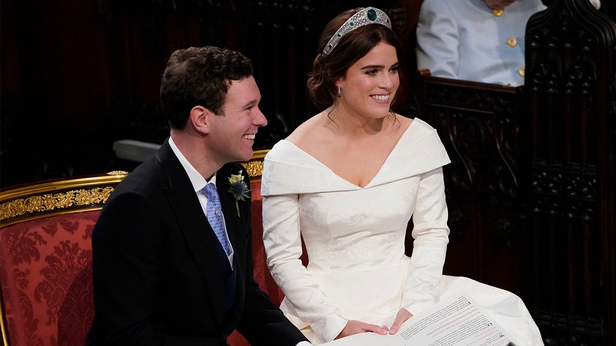 Britain's Princess Eugenie and Jack Brooksbank during their wedding ceremony in St George’s Chapel, Windsor Castle, near London, England, Friday, Oct. 12, 2018.