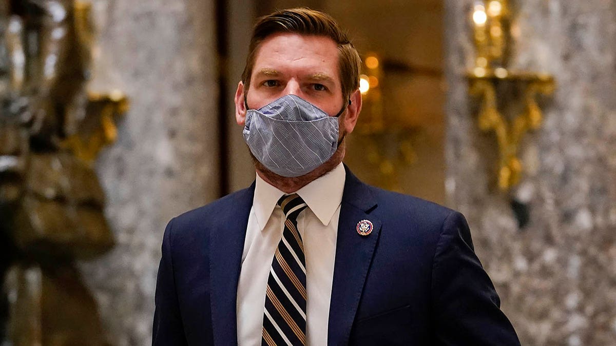 Impeachment manager Rep. Eric Swalwell, D-Calif., walks on Capitol Hill in Washington, Wednesday, Jan. 13, 2021. (AP Photo/Susan Walsh)