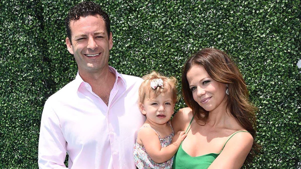 Tammin Sursok (right) said that her husband Sean McEwan (left) has had a high fever. (Photo by Michael Buckner/Getty Images for FIJI)