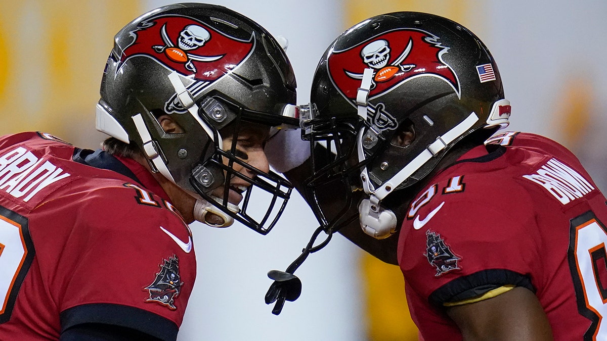 Tampa Bay Buccaneers quarterback Tom Brady (12) and wide receiver Antonio Brown (81)